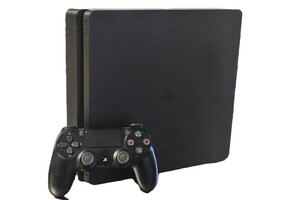Sony PlayStation 4 Slim 1TB with controller and cords