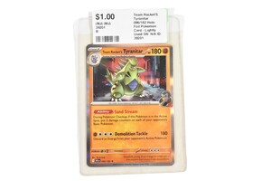 Team Rocket's Tyranitar Pokemon card - lightly used